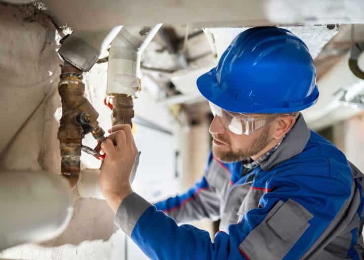 water repair expert fixing a pipe in Brookville, FL
